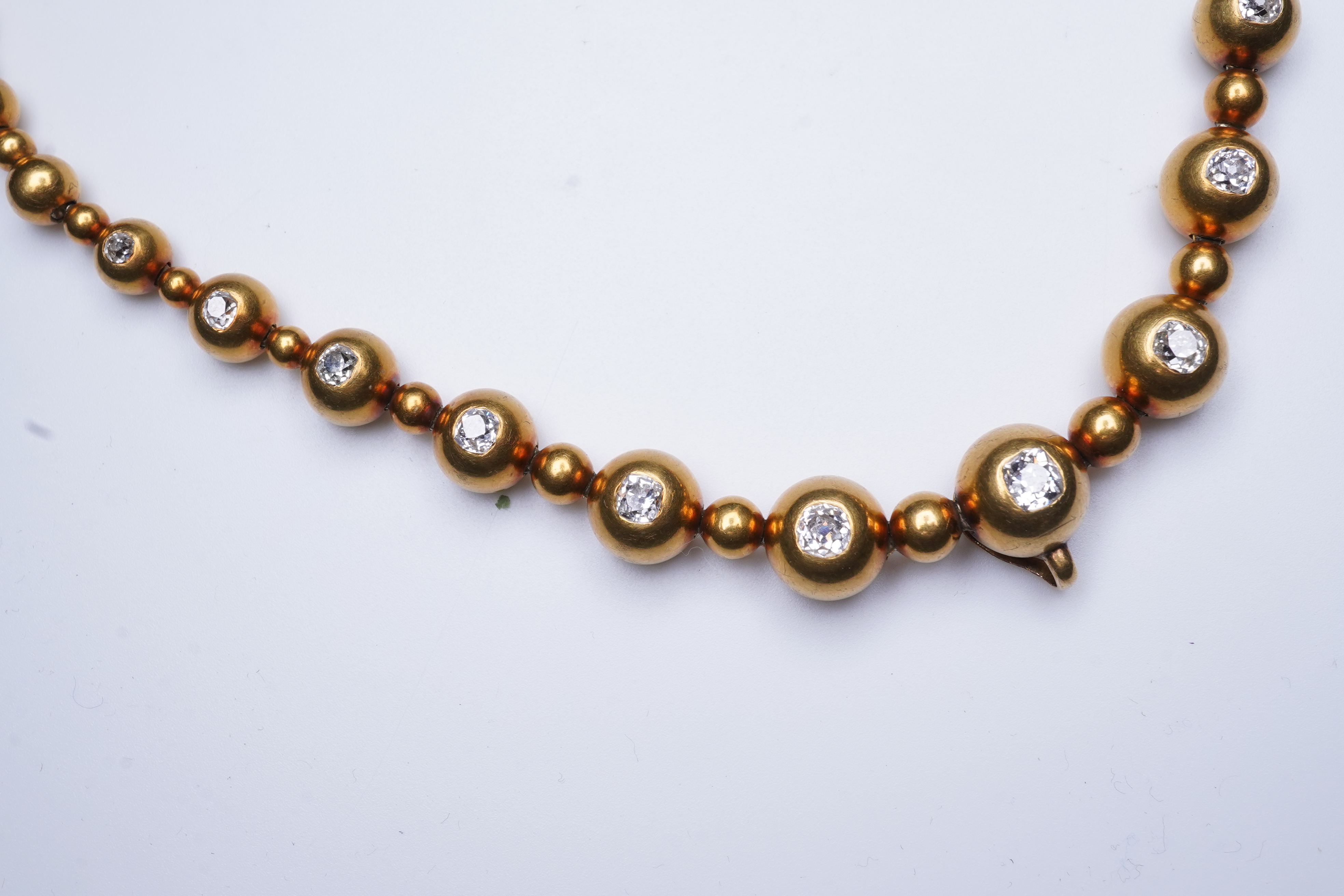 An unusual Victorian gold and diamond necklace, late 19th century